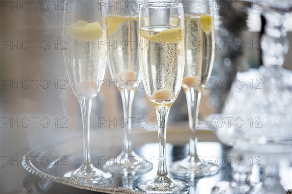 Champagne in champagne flutes on tray