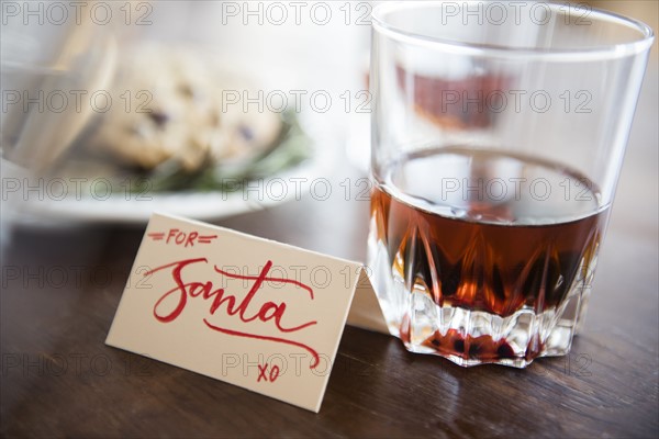 Manhattan drink and cookies on table during Christmas