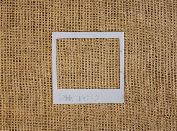 Studio shot of picture frame on fabric
