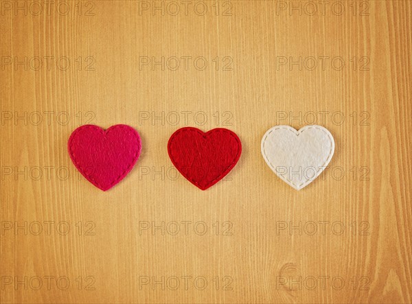 Three hearts cut out from fabric