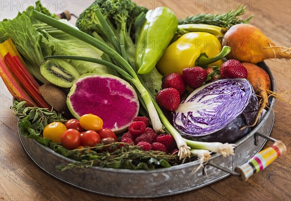 Fruit, vegetables and herbs on tray