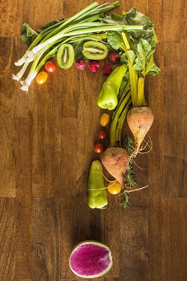 Question mark shape made with fruit and vegetables