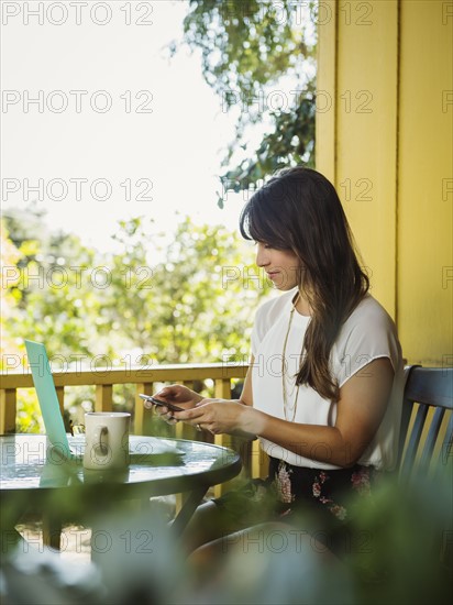 Young woman using phone