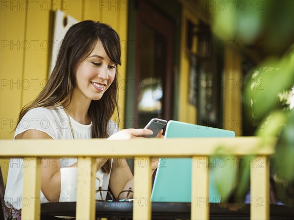 Young woman using phone