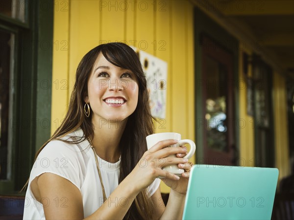 Young woman holding mug