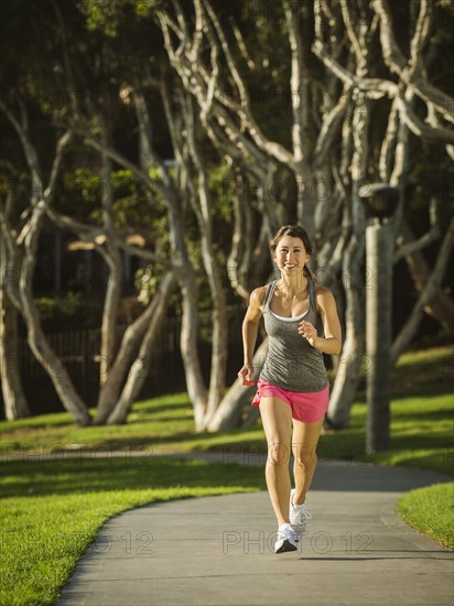 Young woman running in park