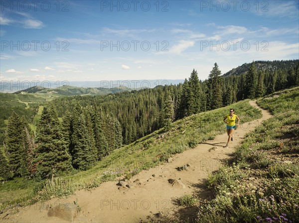 Mature woman running in mountains