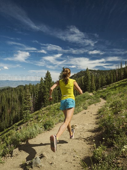 Mature woman running in mountains