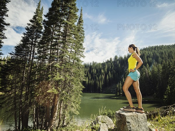 Mature woman standing on rock