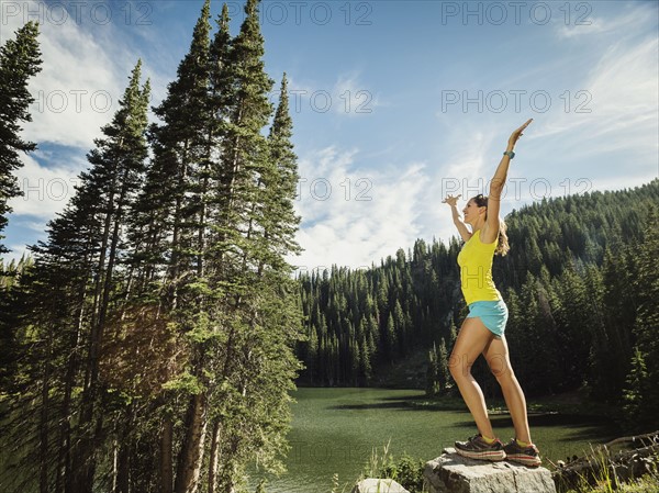 Mature woman standing on rock