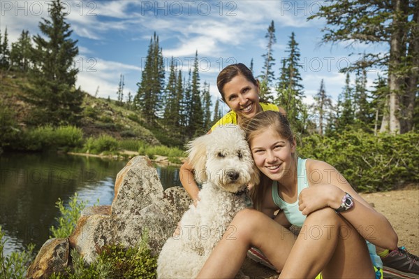 Mother and daughter (14-15) with dog