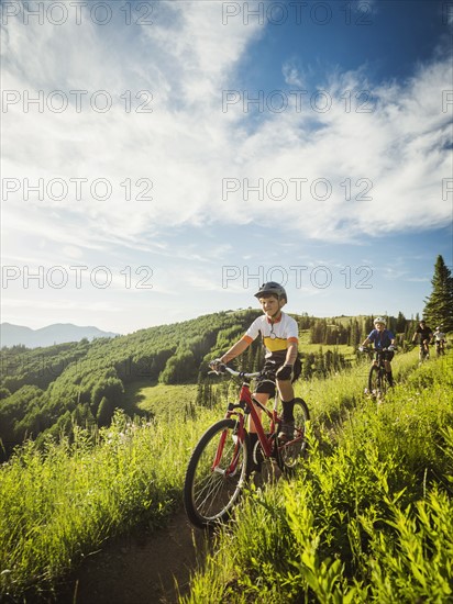 Parents with sons (10-11,12-13) during bike trip