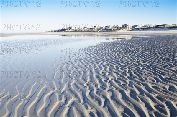 Beach at low tide with rippled sand