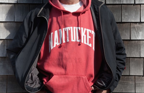 Mature man in hooded sweatshirt and jacket