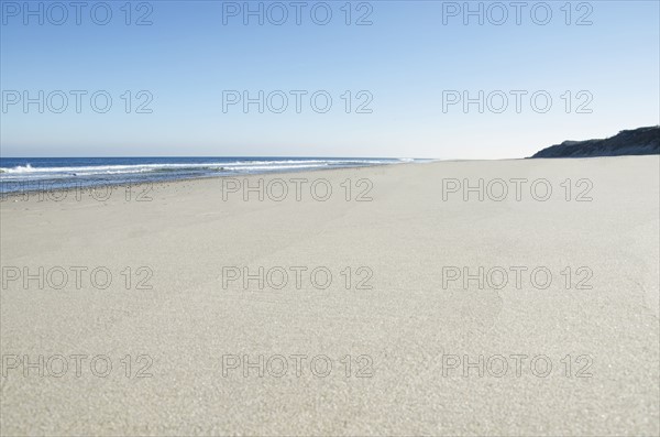 Empty beach on sunny day