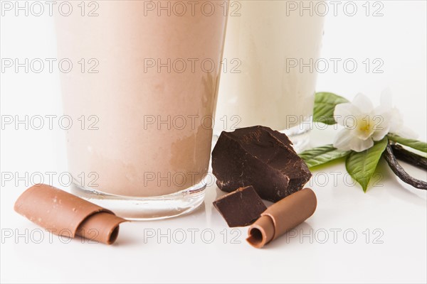 Chocolate and vanilla smoothies decorated with pieces of chocolate