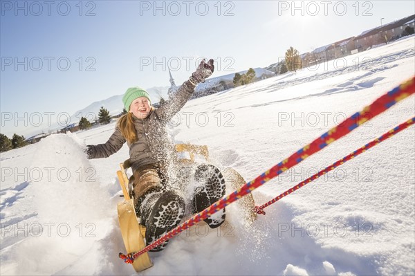 Children (8-9) riding sled