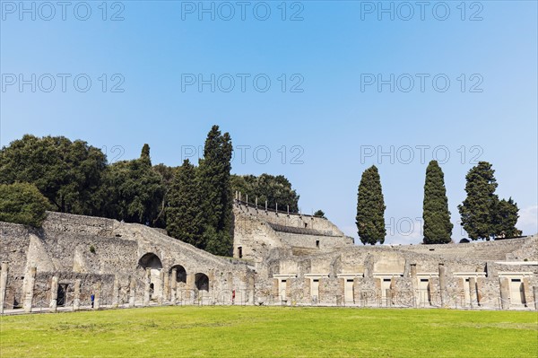 Ancient ruins of with amphitheater in background