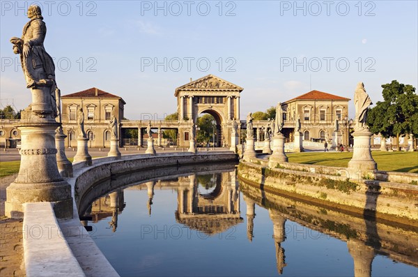 Prato della Valle with statues at dusk