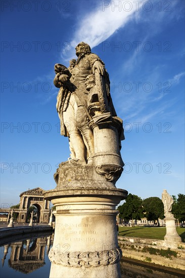 Statue on Prato della Valle under blue sky