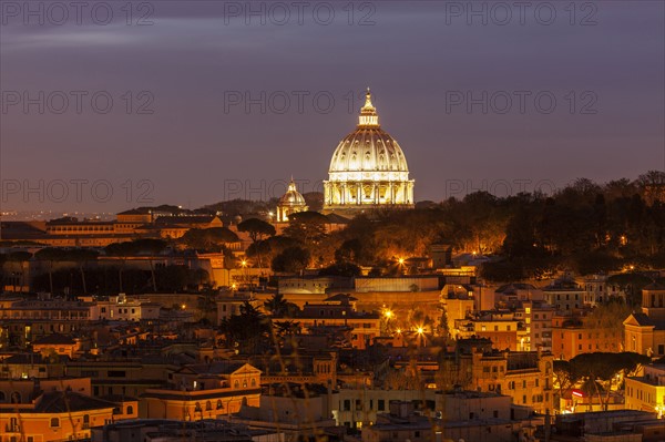 Illuminated St. Peter's Basilica at dusk