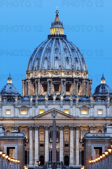 Illuminated St. Peter's Basilica at dusk