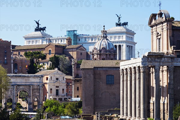 Roman Forum and Monument of Vittorio Emanuele II against blue sky