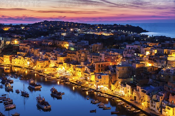 Illuminated townscape on Marina Corricella on Procida Island