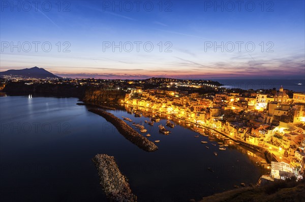 Illuminated townscape on Marina Corricella on Procida Island