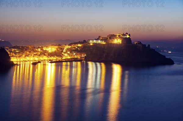 Illuminated townscape on Marina Corricella on Procida Island