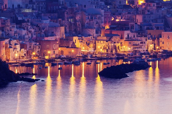 Illuminated townscape on Marina Corricella on Procida Island