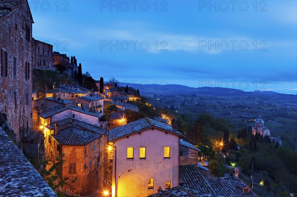 Montepulciano, Illuminated houses on rocks under cloudy sky