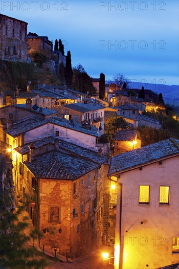 Montepulciano, Illuminated houses on rocks under cloudy sky