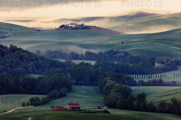 Rolling landscape with farmhouse