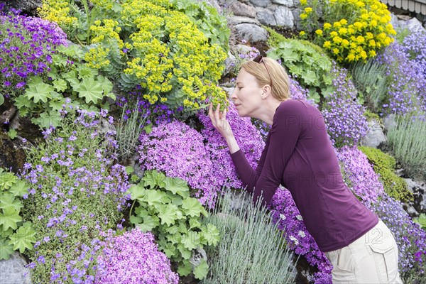 Woman smelling flowers