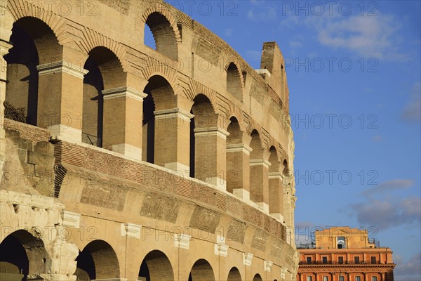 Facade of Coliseum against cloudy sky