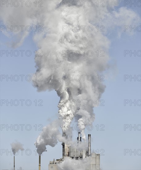 USA, New York State, Industrial smoke stacks against sky