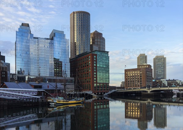Waterfront buildings reflecting in water