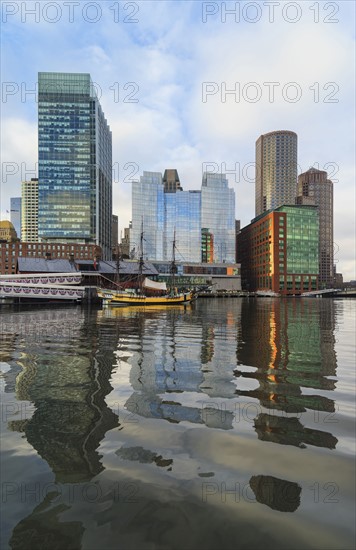 Waterfront buildings reflecting in water