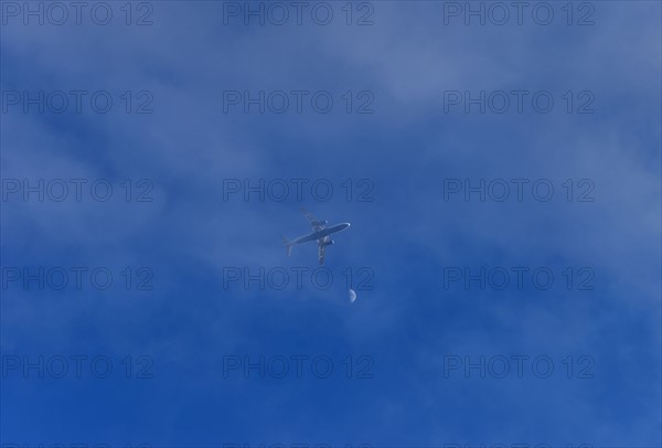 Airplane in cloudy sky