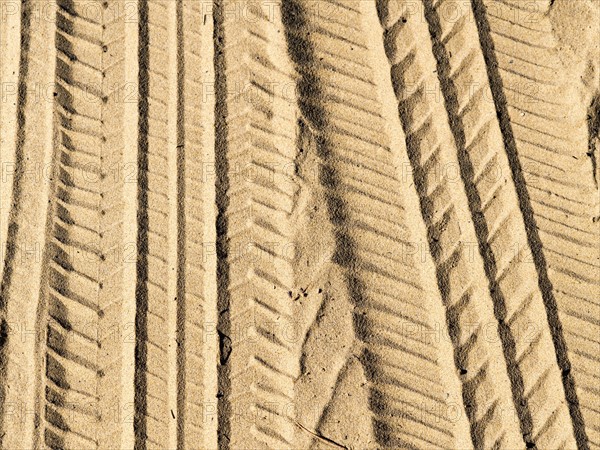 Tire tracks in sand