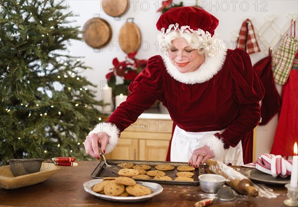 Mrs. Claus making gingerbread cookies.