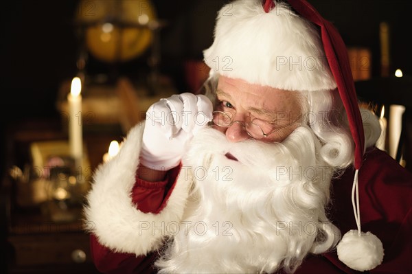 Portrait of Santa Claus winking.