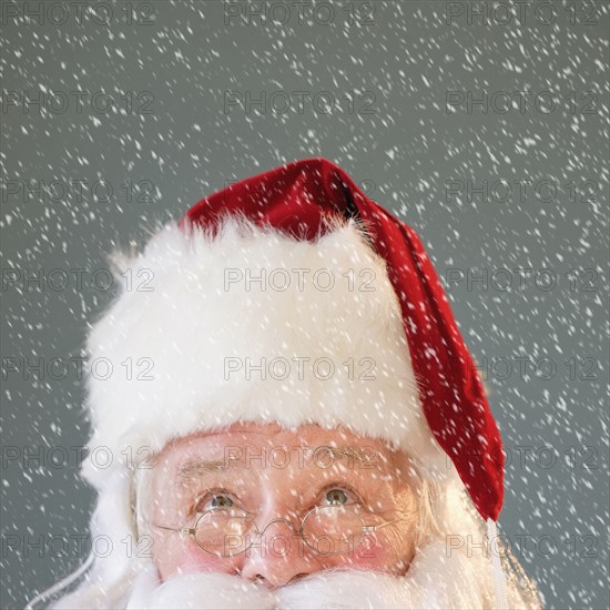 Portrait of Santa Claus looking up.