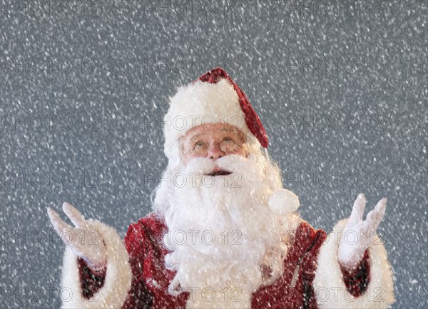 Portrait of Santa Claus looking at snow.