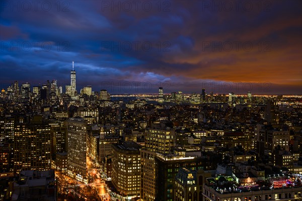 Illuminated cityscape at night. USA, New York, New York City.