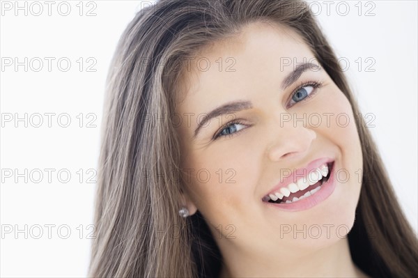 Portrait of young woman with brown hair.