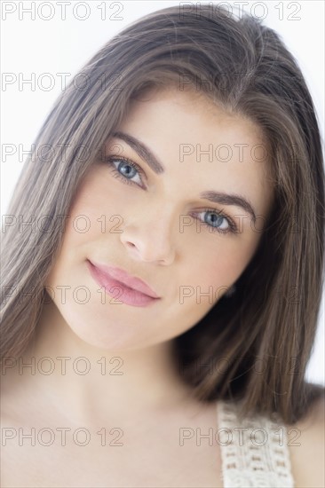 Portrait of young woman with brown hair.