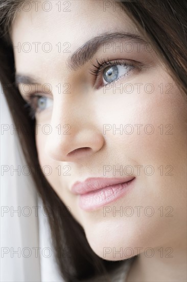 Portrait of young woman with brown hair.