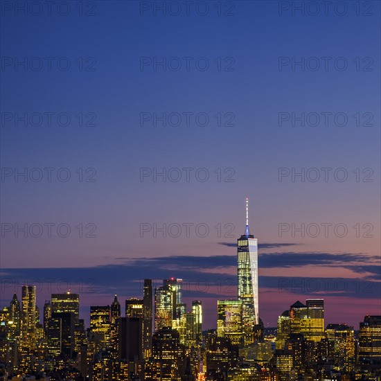 Skyline of New York at dusk with view of One World Trade Center. USA, New York, New York City.